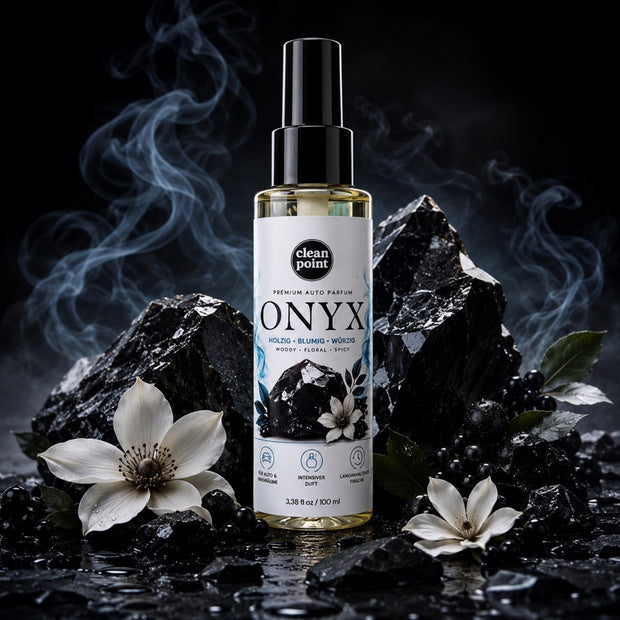 ONYX Premium Auto Parfum mit Onyx-Steinen und weißen Blüten in luxuriöser Produktinszenierung